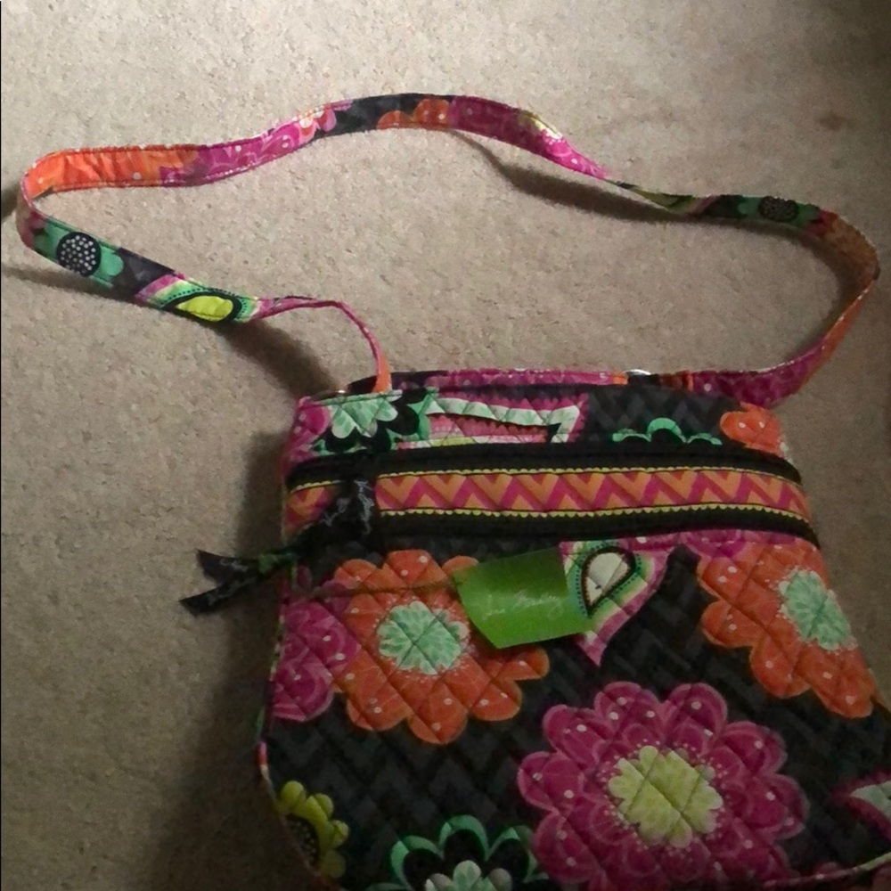 I never worn vera Bradley purse